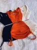 Tweede stuk jurk Streetwear Knit Sets Sets Crop Tops Mini Rok bijpassende oranje trekkoord Zwarte pakken