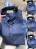 Mode Luxe Buurberlyes Kleding voor vrouwen Men Italiaanse klassieke heren Warhorse geborduurd shirt Solid Color Lange mouwen shirt met merk origineel logo