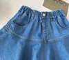 Ragazze per bambini in denim Short Short Short Gonne arruffate di torta Arrivo per bambini Princess Casual Skirt Style Korean Cute Cotton Skirt 240428