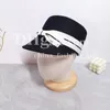 Chapeau de paille de luxe Femmes Bow top chapeau d'été seau de voyage de voyage Vacation Sunshade Hat à l'extérieur