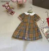 Ny prinsessklänning kortärmad docka krage baby kjol storlek 90-140 cm barn designer kläder checker design flickor partydress 24 april