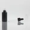 Bouteilles de rangement Produit Bouteille d'huile de parfum 1 oz noir / noir givré 30ml essentiel 100pcs rechargeable