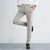 Pantalon masculin style mode mode simple élégant haut élastique hommes bouton de poche à fermeture éclair solide printemps pantalon décontracté en soie à glace droite