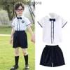 Sukienki dla dziewczyn 2PCS 2023 Summer Teens Girls Chłopcy Tkanina JK BOWIN BIAŁA KORTA BLUSE + Sukienka lub krótkie spodnie Dzieci Zestaw Korea School Q240418