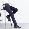 Pantalon masculin style mode mode simple élégant haut élastique hommes bouton de poche à fermeture éclair solide printemps pantalon décontracté en soie à glace droite