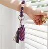 Handgefertigter Quastenholz Holz Perlen Keychain Purple Hand gewebten Parfümhalter Armband Silikon Chapstick Schlüsselbund DF089