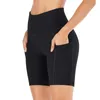 Kvinnors leggings sömlösa stickade fasta färgskinkor shorts andas med hög elastisk sport som kör yogabyxor