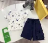 Marke Baby Tracksuits Jungen kurzärmeliger Anzug Kinder Designer Kleidung Größe 100-160 cm T-Shirt und Taschen-Dunkelblaue Shorts 24APRIL