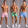 Pantaloncini sportivi in esecuzione estiva uomo a secco rapido jogging cortometraggi in spiaggia bodybuilding fitness shorts brand brand palestra abbigliamento 240412