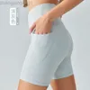 Desginer Aloe Yoga Mujer pantalón Top Mujeres Cantbed Shorts altos pantalones cortos de bolsillo doble de bolsillo