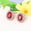 Pendientes de sementales Classic Red Crystal Pendiendo para mujeres Moda Rose Gold Color Fashion Cz Stone Jewelry Brinco Dwe108