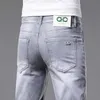 Männer Jeans Designer Europäische Markenjeans, elastische Slim -Fit, kleine Füße, dünne Kleidung, leichte Luxus, modische Freizeithosen B2VP