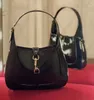 2024 Mulheres vermelhas Bolsas de moda Designer de qualidade Bolsas de ombro de luxo Borgonha preta corporal trava de metal com patente de camurça de camurça de camurça bolsa com caixa