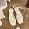 Sandaler Sandaler Womens Summer New 2024 Beach Fashion Sexig Flat Casure Cross Tie Open Toe Fairy Style SMRIKA BANDSKODA SVARA SANDALER Q240419