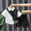 Childrens Sets Jungen fashion schwarz weißer Spleiß Einbrühmtes Babyhemd Shorts Handsome Street zweiteilige Sommerkleidung 240408