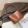 Schoudertassen vintage mini pu lederen tas voor vrouwen 2024 wintertrend handtas dame trending reisemmertemuls portemonnee