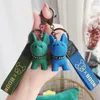 Keychains Designer Accessories Cortes de dessins dessinons Méthode de résine Dogie femme Keychain Couet Creative Delicate Bulldog Key Chain Couple Sackepack Key Pendant