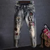 Męskie dżinsy zwężane dżinsy graficzne dla mężczyzn z drukowaniem hip -hopowym motocykl męskie spodnie kowboj
