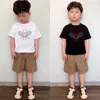 夏の子供たちのトレンディブランドの新しい短袖パンツコットン2ピースセット男性と女性向けの西洋のハイエンドの子供服セットハイエンドの赤ちゃん