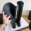 Chaussures bottes petits parfums longs hiver mi-longueur en cuir en cuir talon plat pour femme à la glissière martin martin