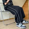 Pantalon masculin 2024 Tendance de printemps Tracksuit Corseted pieds décontractés tout le tout sous-pants