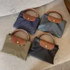 Dumpling Travel Bag Designer Väskor för Women Clearance Stora Nylon Handbag Women 2024 Duffel Leather Clutch On Bagage Men Basketball Totes Clear Handbag Bqqt