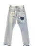 Splash Ink Graffiti GD 2024 Nouveau micro-haut-parleur épissant des trous décontractés jeans lâches pantalons longs hommes et femmes American High Street Slim Pantalon de jambe droite