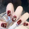 Valse nagels 24 stks rode nep nagels met glanzende gouden boogontwerp kunstmatige nagelpatch voor dame meisje draagbare volledige cover mode valse nagel tips y240419