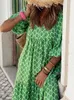 Grundläggande avslappnade klänningar Boho Maxi klänning kvinnor blommor tryck sommarlovstrand klänning kvinnlig kort puffhylsa lös sundress green vestidos mujer 240419