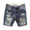 Shorts en jean déchirés pour hommes Pantalons shorts minces d'été à la mode avec des trous de conception déchiré en détresse jeans courts de style coréen mâle 240403