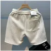 Heren shorts 2024 Men Fashion katoen gemengde stevige kleur die de taille zomer multi-pocket shorts brede strand casual shorts hot selling 240419 240419 losmaken