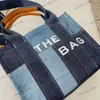 A bolsa de sacola de sacola de designer bolsas de travestia de lona de lona manusear tout homen woman hand bolsa de mão 3 tamanhos letras de moda imprimir jeans azul compras luxuosas bolsas grandes de luxo