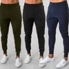 Calças de corrida homens esportam calças de moletom de corredores de algodão Trackpants de algodão Slim Fit Bodybuilding Troushers 240418