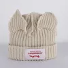 Petit chapeau de laine d'oreille de cochon fait à la main pour l'automne et la chaleur hiver