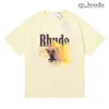 Rhude New 2024 Дизайнерская мужская футболка мода мода графическая печатная женская одежда мужская одежда рубашка рубашка с коротким рукавом с короткими рубашками.
