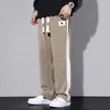 Pantalon pour hommes surdimensionné hommes simples streetwear quotidien printemps d'automne latérale rayure drawstring occasionnelle pantalon masculin de style américain lâche doux