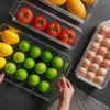 Bouteilles de rangement transparent produit un réfrigérateur empilable avec couvercle pour l'organisation de légumes de fruits carton d'oeuf