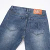 Heren jeans ontwerper lente/zomer dunne high -end European slanke fit kleine voeten trendy merk lichtblauwe broek xib0