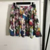 Set setki setów designerskich garnituru Women 2pcs marka krótkiego rękawu koszula moda moda kolorowe kwiaty Logo Dwuczęściowa sukienka krótka dords 20 kwietnia