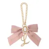Japanese Sweet Cute Womens Bow Ornament Pendant Bag Accessories Fashion Elegant Delicate Pearl Metal Chain Bag Accessories 240419