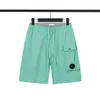 Designer masculino shorts de nylon de metal hight street shorts esportivos rápidos secagem de roupas de banho de praia calças de praia