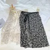 Kjolar koreanska vintage bowknot jacquard se genom spets lång kjol höft halsduk för kvinna