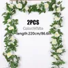 Flores decorativas 2pcs Flor branca artificial Falsa Rosa pendurada 2,2m Plantas de videiras deixa decoração de festa de casamento artificiais de guirlanda