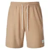 Shorts Man Summer Nuovi pantaloni della tuta con lacci a colori solidi vellutoy semplice quartiere pantaloni casual maschi