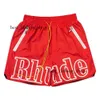 Rhude Shorts Sport Mens Designer Krótkie zestawy mężczyzn Spodnie dresowe luźne i wygodne moda być popularnym 2024 Nowy poliester luźne najlepszą jakość 240