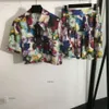 Set setki setów designerskich garnituru Women 2pcs marka krótkiego rękawu koszula moda moda kolorowe kwiaty Logo Dwuczęściowa sukienka krótka dords 20 kwietnia