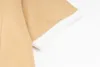폴로 셔츠 디자이너 폴로 셔츠 맨 패션 초점 자수 뱀 가터 작은 꿀벌 인쇄 패턴 옷 의류 티 흑백 남성 T 셔츠 Q57