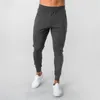 Calças de corrida homens esportam calças de moletom de corredores de algodão Trackpants de algodão Slim Fit Bodybuilding Troushers 240418