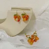 Orecchini a pennaglietta e simpatica nappa arancione rotonda per femmina orecchio femminile trafitto fresco estate di nicchia di nicchia di moda Gift da banchetto