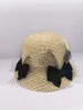 Chapeaux à bord large S202403-XUXU INS chic Summer Migne Mesh Bowknot Natural Raffia Grass Sunshade Lady Bucket Cap Women Hat de loisirs